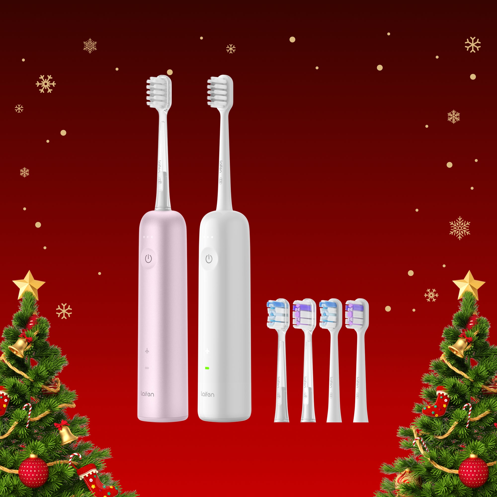 Zwei elektrische Zahnbürsten in Rosa und Weiß mit mehreren Ersatzbürstenköpfen